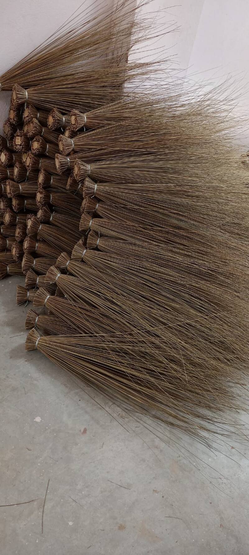 Bulk stock of natural fibre brooms